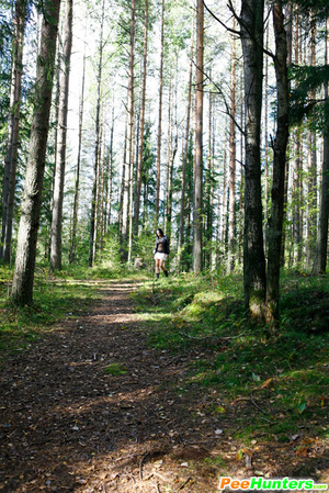Swarthy puss searching for a quiet place to pee
