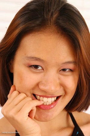 Busty Asian teen babe pleasing her hairy snatch