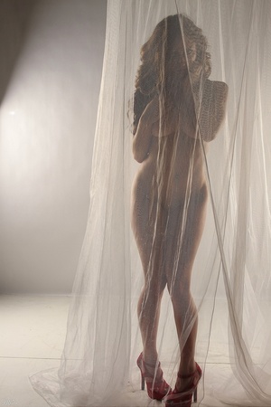 Naked babe pose curtain