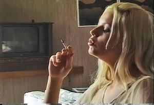 Lovely blonde babe loves to smoke a lot at home