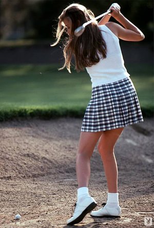 Teenage chick playing golf