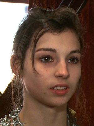 Lady holds vibrator clit