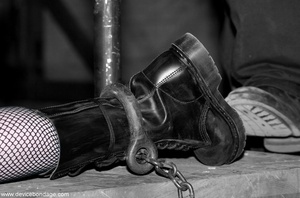 Caged slaves play leads