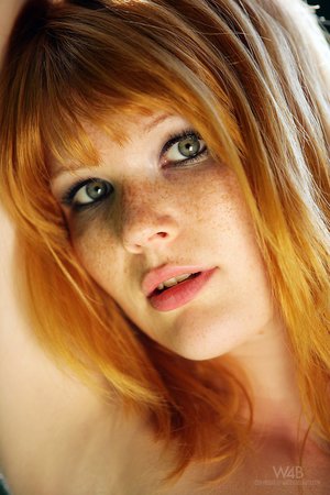 Redhaired chick amazing posing
