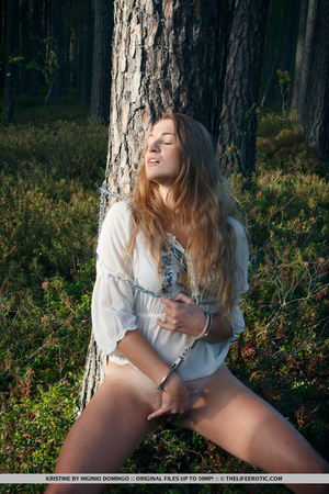Lovely girl bound tree