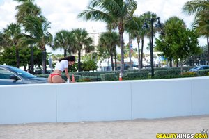 Rolling beach young brunette