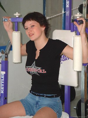 Cute alluring lassie with short brown hair is seen working out in the guy