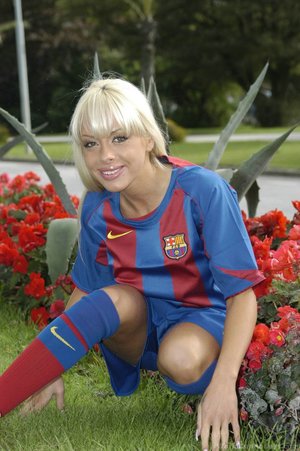 Sporting a barcelona football uniform she exposes her sexy tits and a slim body
