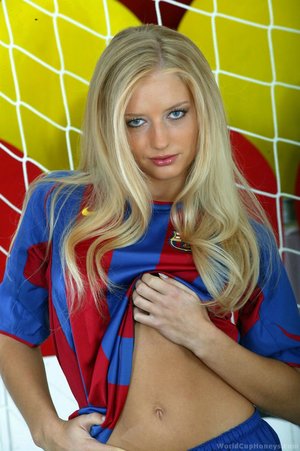 A barcelona fan whos blonde decides to pose in a uniform