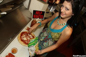 Petite chef enjoys her erotic sideline activity while making a pizza