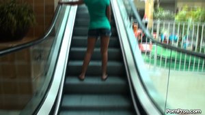 Small chick in shorty shorts displays her flawless legs in the mall