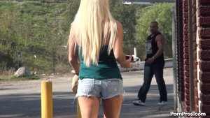 Blonde slut in green tube talks dirty with her man outdoor