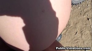 Leaning against her yellow dirt bike, she exposes her big tits and drops her bottom