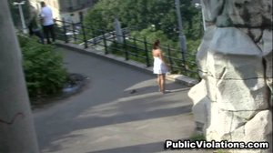 Walking, aimlessly, in the park, this tramp in a white dress struts her stuff