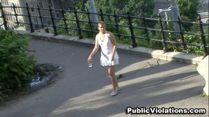 Walking, aimlessly, in the park, this tramp in a white dress struts her stuff