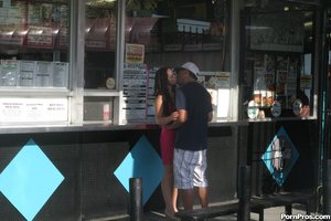 Pushing her against the storefront business, he makes out with this bombshell