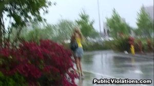 As she squats behind a car, this blonde in yellow is assaulted by a stranger