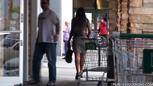 Following her from the supermarket to the street, he stalks her with his camera