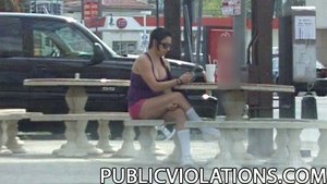 Chubby, in purple and pink, she hangs out in a public place, being filmed from a distance