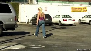 Tall and blonde, she struts around town, showing off her large tits