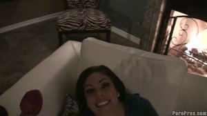 Lying on her back, tiny tits on display, she smiles and spreads her thick thighs