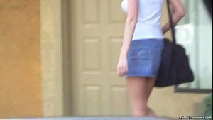 Strutting around in a denim skirt, she shows off her sexy body
