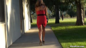 Flaunting her sexy body, in high heels and a short skirt, she struts around
