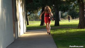 Flaunting her sexy body, in high heels and a short skirt, she struts around